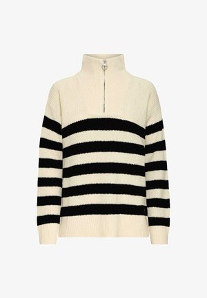 Pull en tricot avec un col haut, présentant des rayures alternées noires et blanches, des poignets côtelés et une fermeture éclair de mi-longueur au niveau du col.