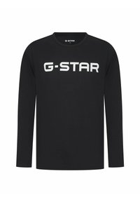 Zwarte lange mouw T-shirt gemaakt van katoen, met een groot wit "G-STAR" logo over de borst, voorzien van een ronde halslijn en een reguliere pasvorm.