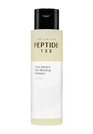 Bouteille de shampooing Peptide 132 Ultra Perfect Hair Bonding avec une étiquette beige et un bouchon à clapet noir.