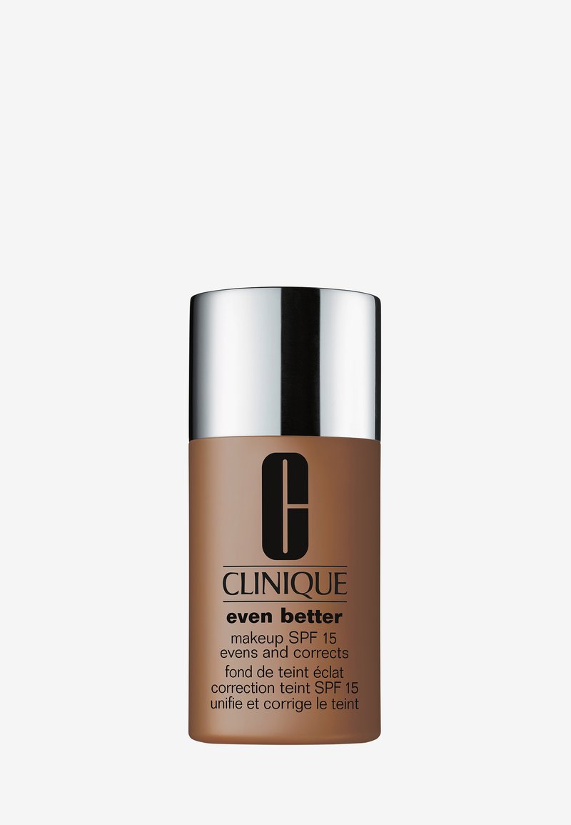 Bottiglia di fondotinta Clinique Even Better, in vetro marrone con tappo a vite argentato, con testo scuro e etichetta SPF 15 sulla parte anteriore.