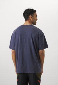 Under Armour ATHLETES  - T-shirts print - washed navy/blue smoke