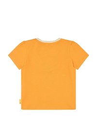 Kurzärmliges Rundhals-T-Shirt aus leuchtend orangefarbenem Baumwollstoff, mit einem cremefarbenen Besatz am Ausschnitt und kleinen Puffärmeln.