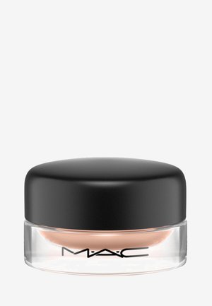 MAC kremprodukt i en klar glasskrukke med lokk av svart plast. Innholdet er en jevn, ferskenfarge. Har MAC-logoen.