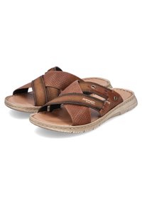 Sandales à glissière en cuir marron avec un dessus perforé, un design à lanières croisées, une semelle en caoutchouc et des accents de couture subtils. Légères et respirantes.