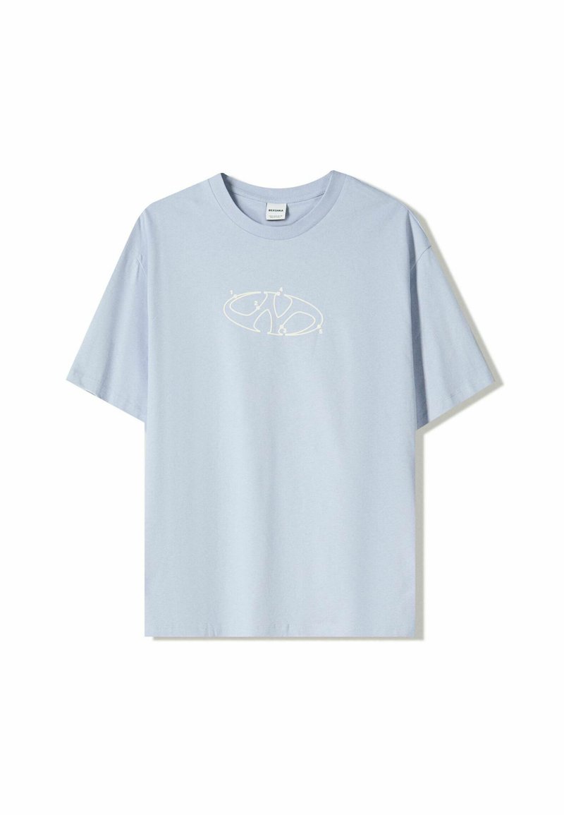 Light blue cotton t-shirt with short sleeves and a round neckline. Features a white graphic design on the front with abstract shapes.