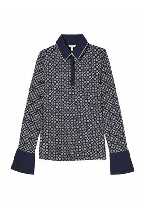 Navy long-sleeve shirt with a geometric cream pattern, a pointed collar, and bell cuffs; made from a smooth, lightweight fabric.