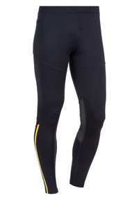 Musta leggings, jotka on valmistettu joustavasta kankaasta, sisältävät keltaisen raidallisen ja verkkopaneelin sivuilla. Suunniteltu sleekiksi ja tiukoiksi.