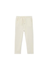 Pantalon de survêtement couleur crème en tissu doux, doté d'une taille à cordon de serrage et de deux poches latérales. Design simple avec une coupe décontractée.