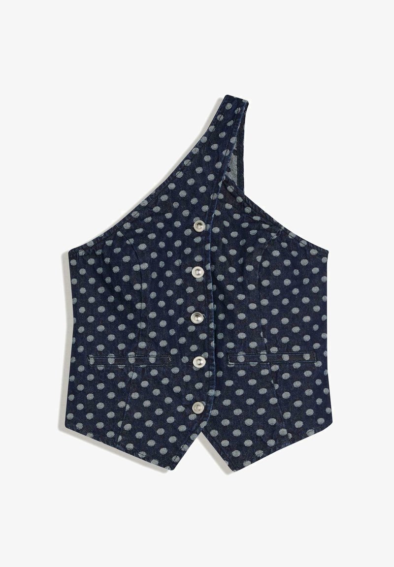 Veste bleu marine à une épaule avec des pois gris clair et cinq boutons sur le devant, comprenant deux petites poches passepoilées horizontales.