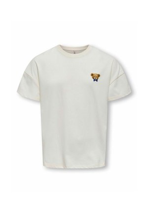 Crème-kleurige katoenen t-shirt met korte mouwen, met een geborduurde teddybeer op de linkerborst die een blauwe vlinderdas draagt.
