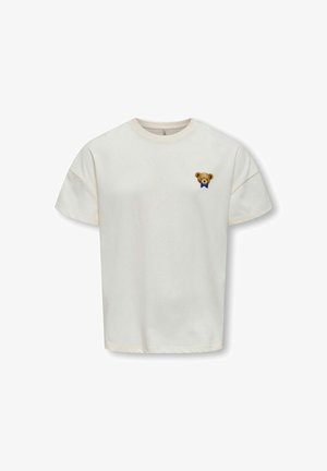 Crème-kleurige katoenen t-shirt met korte mouwen, met een geborduurde teddybeer op de linkerborst die een blauwe vlinderdas draagt.