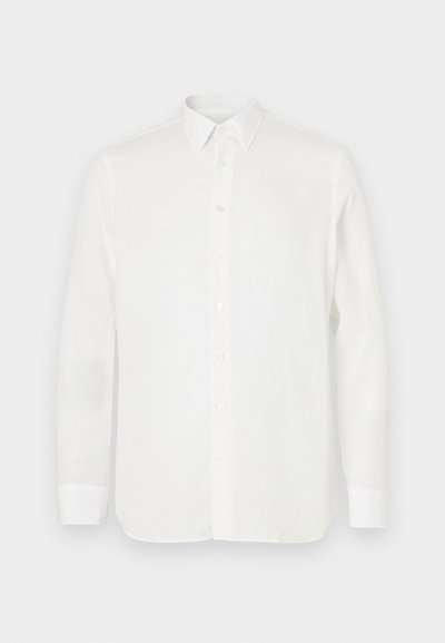 Valge pika varrukaga särk, mis on valmistatud kerge kangaga, klassikalise kraega, nööpide sulgemisega ja sirge lõikega hemiga. Sujuv tekstuur.