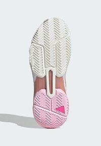 Sport shoe sole with a pink and white rubber design. Features a herringbone pattern for traction and a distinctive logo in pink.