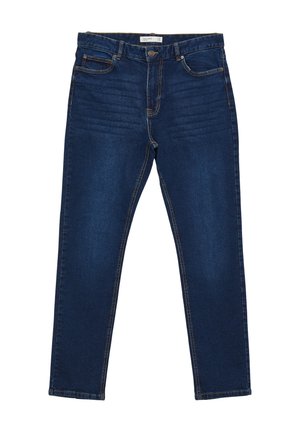 Jeans en denim bleu foncé avec une coupe ajustée, cinq poches et des coutures visibles. Le tissu a une texture lisse et un léger effet stretch.