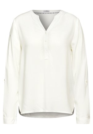Witte blouse met lange mouwen, een V-hals, knopenlijst en zijsplitten. Zachte stof met een gladde textuur en opgerolde manchetten.