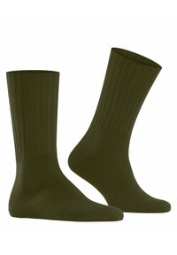 Olivgrüne gerippte Socken mit klassischer Form, strukturiertem Material und mittelhohem Schnitt. Leichtes und nahtloses Design für mehr Komfort.