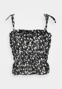 Haut à imprimé floral noir et blanc avec bretelles ajustables, texture froncée et ourlet à volants. Confectionné dans un tissu léger, conçu pour une silhouette ajustée.