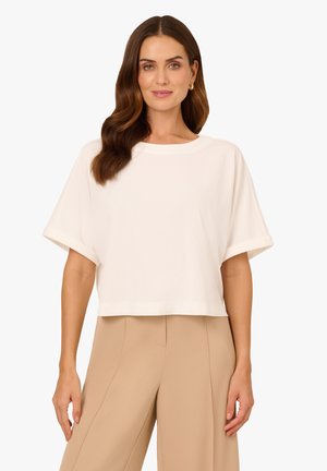 Witte, geknipte t-shirt met een ronde halslijn en korte mouwen. Gemaakt van een gestructureerde stof, met opgerolde mouwranden.