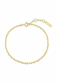 Bracciale in catena d'oro con maglie allungate, dotato di chiusura a moschettone e di un'etichetta attaccata incisa con "Ania Haie."