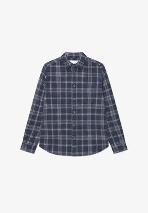 Tumesinise ruudulise mustriga särk kudumiskangasest, millel on nööpidega krae, pikad varrukad ning valged ruudud pronksist nööpidega kaunistatud.