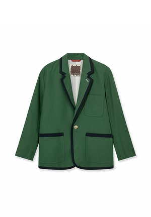 Zelené sako s čiernym lemom, jedným zlatým gombíkom a tromi vreckami, položené naplocho na bielom pozadí.