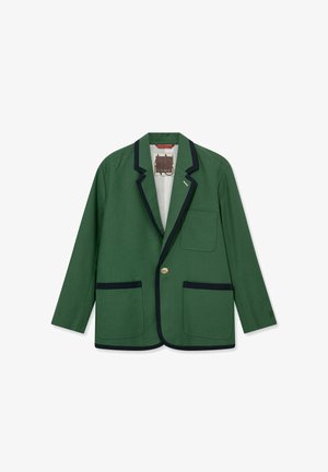 Grøn blazer med sort kant, enkelt guldknap og tre lommer, lagt fladt på hvid baggrund.