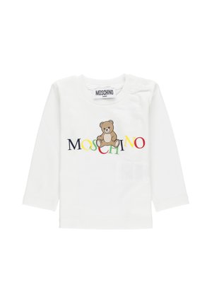 Camisetta bianca a maniche lunghe per bambini con testo multicolore "MOSCHINO" e una grafica di un orsetto marrone al centro.