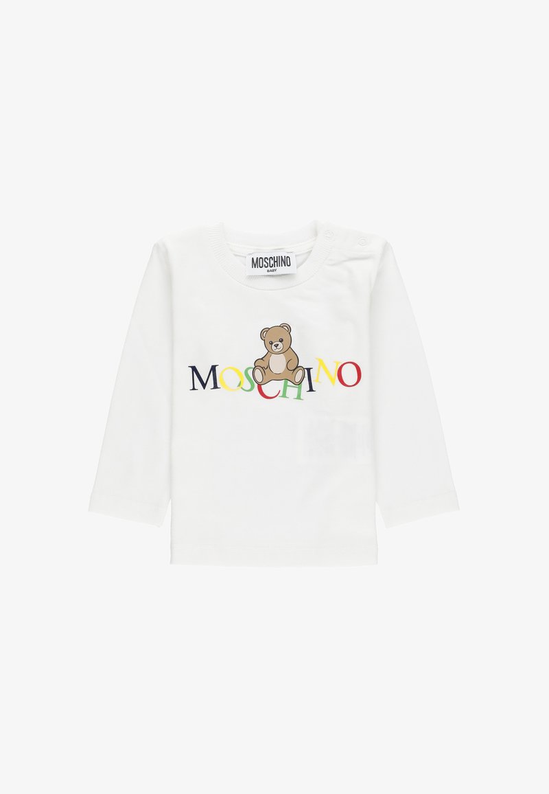 Camisetta bianca a maniche lunghe per bambini con testo multicolore "MOSCHINO" e una grafica di un orsetto marrone al centro.