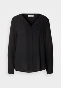 Blouse noire à manches longues avec une coupe ample, des boutons cachés à l'avant et un col en V subtil.