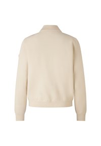 Kremowy sweter dzianinowy z brązowym kołnierzykiem i mankietami, charakteryzujący się minimalistycznym wzornictwem i miękką teksturą. Wyświetlony widok z tyłu.