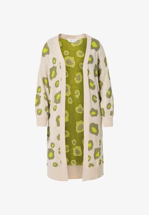 Sweter z dzianiny z beżowym zewnętrzem w zielone plamy, otwarty z przodu, z długimi rękawami. Wnętrze ma jasnobrązowy siateczkowy wzór.