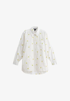 Camisa blanca de manga larga con bordado de limones amarillos, cierre de botones en la parte delantera, cuello y un bolsillo en el pecho. Tejido de algodón suave.
