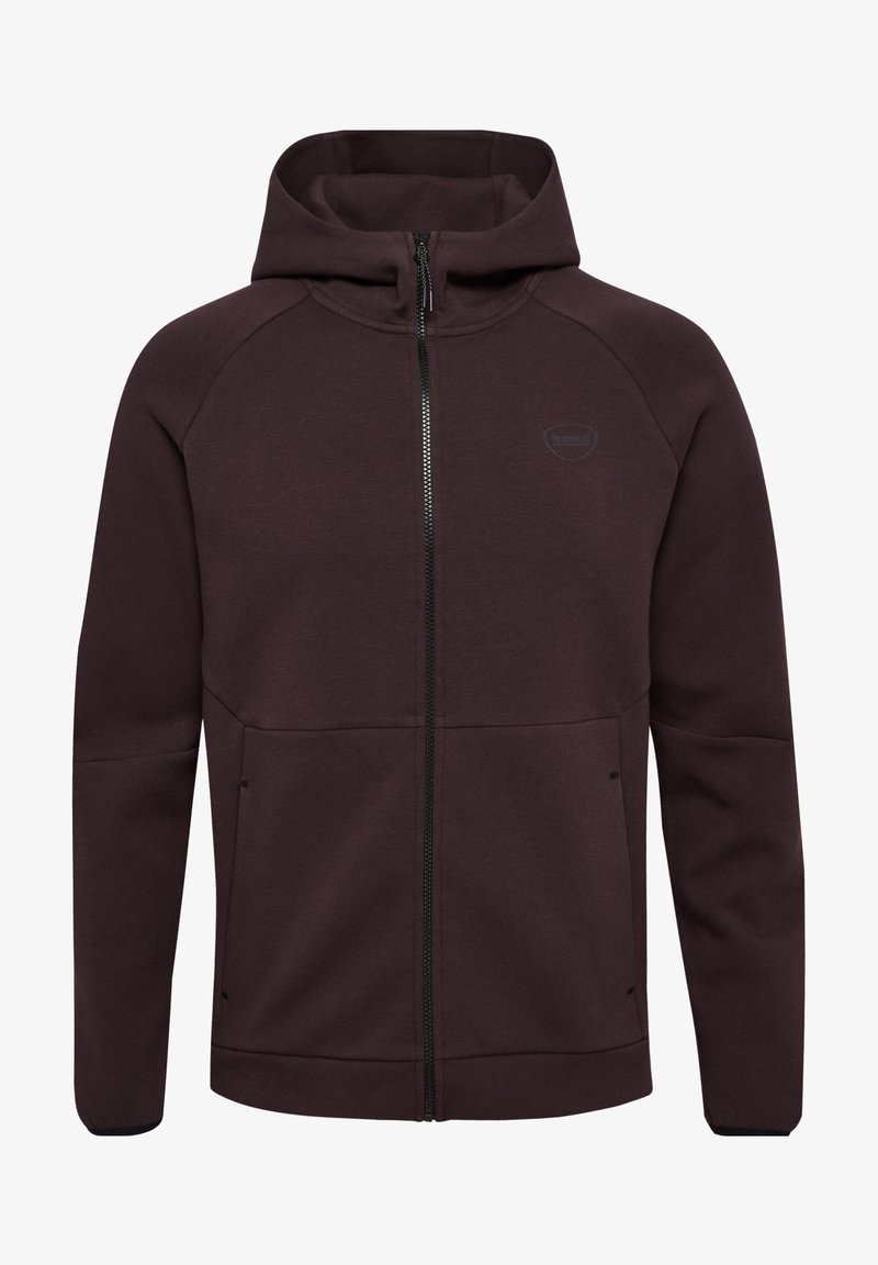 Sweatshirt à capuche bordeaux avec fermeture éclair, manches raglan, deux poches latérales et un logo discret sur la poitrine. Fabriqué en tissu texturé.