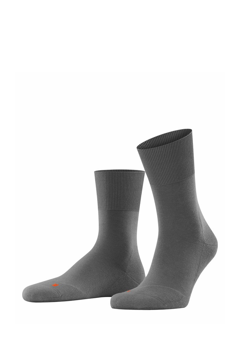 Graue Socken aus einem glatten Material mit einem gerippten Bündchen. Auffälliger oranger Akzent im Zehenbereich. Standard Crew-Länge.