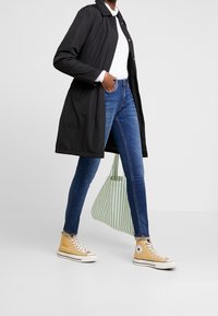 Calvin Klein Jeans Pitkä takki - black