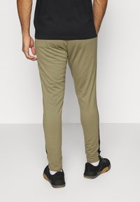Under Armour TRACK SUIT SET - Fato de treino - tent/black