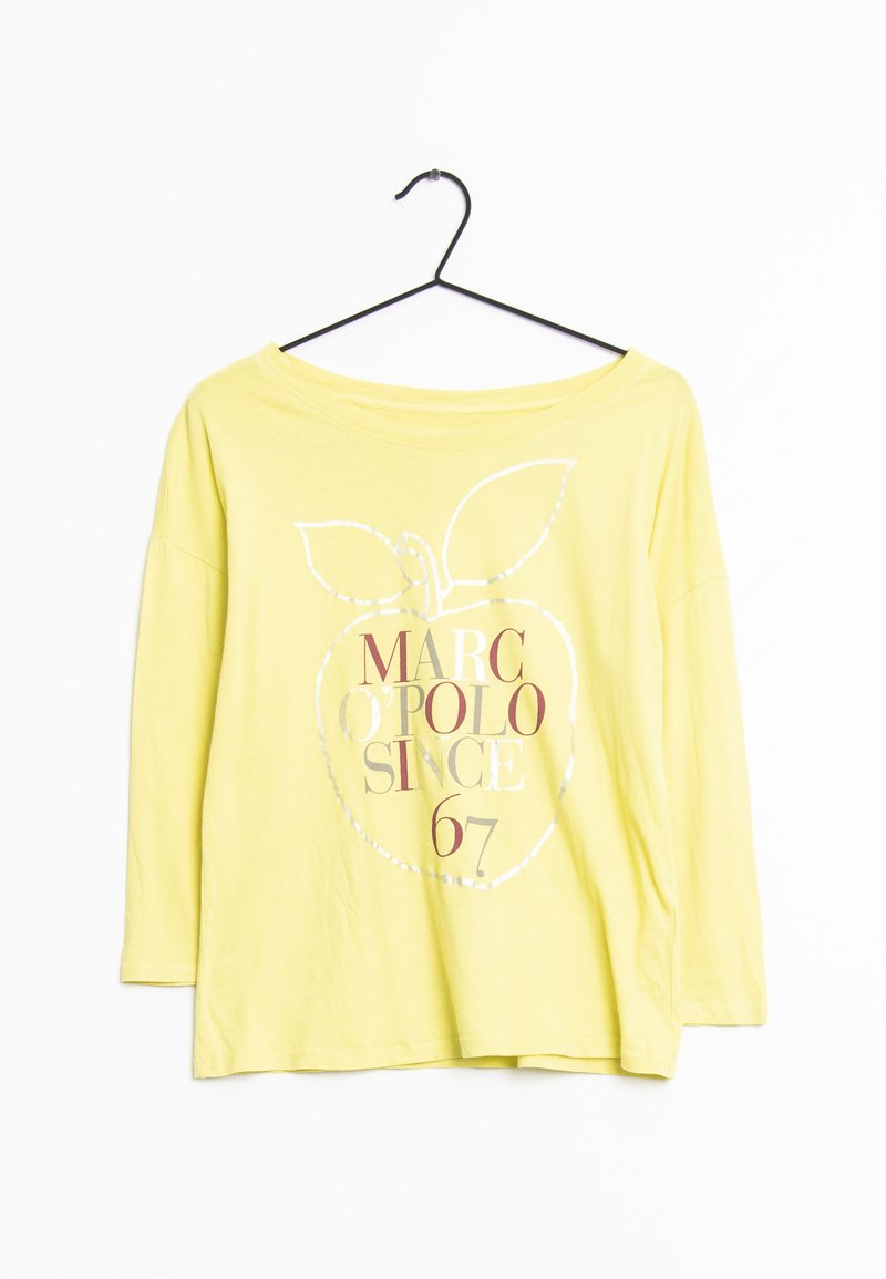Keltainen pitkähihainen paita mustalla ripustimella, jossa on suuri ääriviivakuvioitu omena ja teksti "MARC O'POLO SINCE 67" edessä.