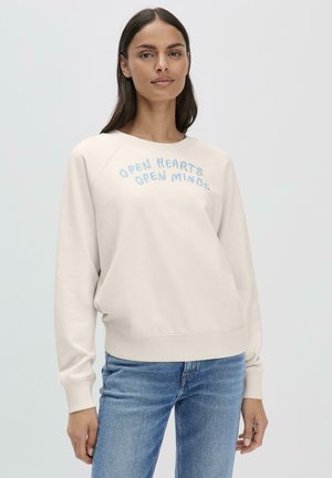 Hellbeige Sweatshirt mit Raglanärmeln, auf der Vorderseite mit blauer, gestickter Schrift "OPEN HEARTS OPEN MINDS". Rippbündchen an Ärmeln und Saum.