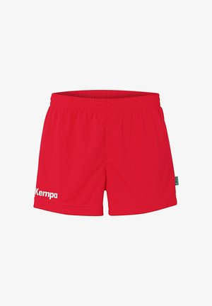 Shorts de sport rouges en tissu respirant avec une taille élastique. Présentent le logo blanc "Kempa" sur la jambe gauche. Design simple et fonctionnel.
