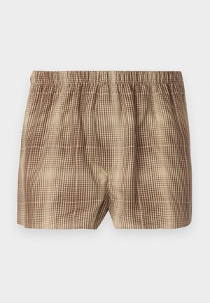 Brown checkered shorts with an elastic waistband, featuring a textured fabric and a loose fit, designed for comfort and ease of movement.