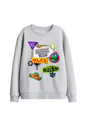 Gray sweatshirt with colorful graphics referencing Stranger Things, including "Hawkins," "I make my own rules," and various symbols and drawings.