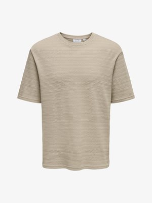 Μπεζ T-shirt με κοντά μανίκια και υφασμάτινο, κυματιστό μοτίβο. Στρογγυλή λαιμόκοψη και χαλαρή εφαρμογή. Κατασκευασμένο από απαλό ύφασμα. Χωρίς ορατή σήμανση.