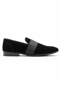 Black suede slip-on shoe featuring a wide black strap, pointed toe, and low rubber heel. Soft texture with smooth accents.
