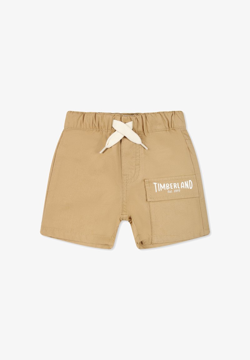 Shorts beiges en tissu léger avec taille élastique et cordon blanc. Comprend une poche latérale et le logo "TIMBERLAND Est. 1973".