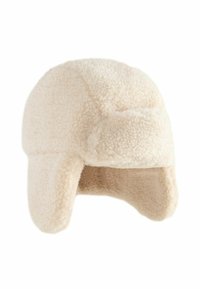 Cappello da trapper in finta pelliccia color crema; parte superiore rotonda, paraorecchie e tessuto testurizzato. Design semplice, materiale morbido e caldo.