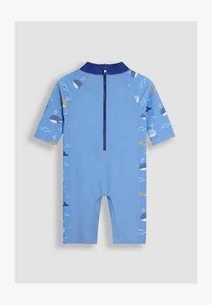 Világoskék, rövid ujjú neopréndressz, cipzárral, az oldalán bálnamintákkal, sima textúrával és kontrasztos sötétkék gallérral.