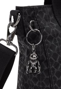 Black fabric bag with a geometric pattern, featuring a silver robot keychain and chrome hardware. Includes a detachable strap.