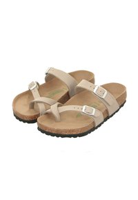 Beige sandals with two adjustable straps, a cork footbed, and a textured black rubber sole. Silver buckles accent the straps.