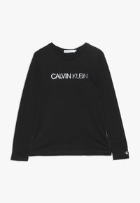 Svart långärmad t-shirt i bomull med en reflexande "CALVIN KLEIN"-logotyp i mitten och en liten logotyp på vänster ärm.