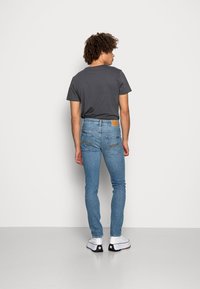 Nudie Jeans GRIM TIM - Calças de ganga justas - blue age